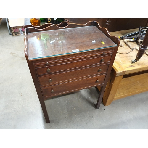 226 - A pair of mahogany tray top Bedside Chests fitted three drawers raised on square cut supports 2ft 4i... 