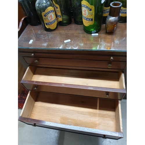 226 - A pair of mahogany tray top Bedside Chests fitted three drawers raised on square cut supports 2ft 4i... 