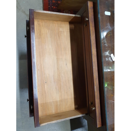 226 - A pair of mahogany tray top Bedside Chests fitted three drawers raised on square cut supports 2ft 4i... 