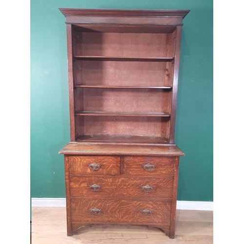 499 - An oak Bookcase the top with moulded cornice and three open shelves, the base fitted two short over ... 