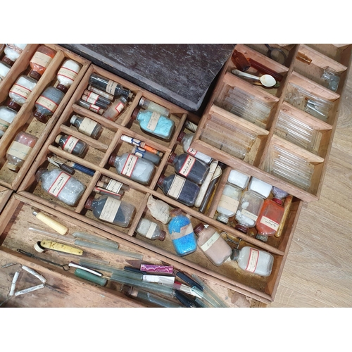 526 - An antique stained pine Chemist's Box containing fitted trays of bottles 2ft 1in W x 1ft 4in H (R7)