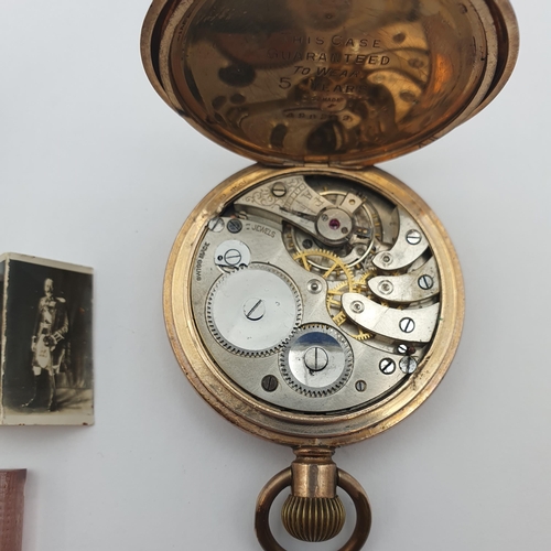 258 - An early 20th century Pocket Watch in gold-plated case, the white enamelled dial having Roman numera... 