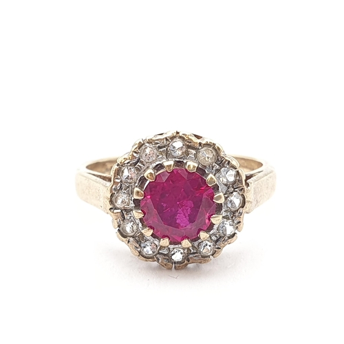 267 - A synthetic Ruby & White Stone (spinel) Ring, claw-set round mixed-cut synthetic ruby surrounded by ... 