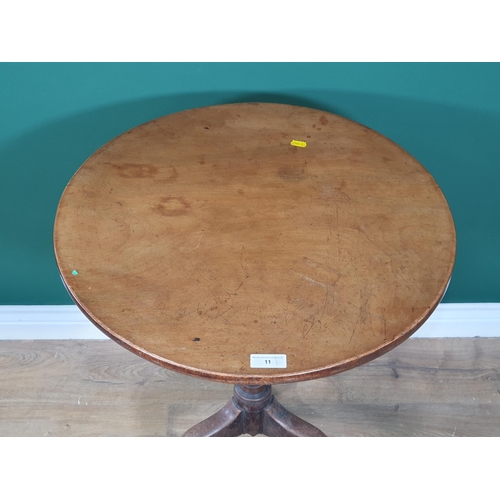 11 - A 19th Century mahogany Pillar Table with circular top on turned column and tripod base, 23in diam (... 