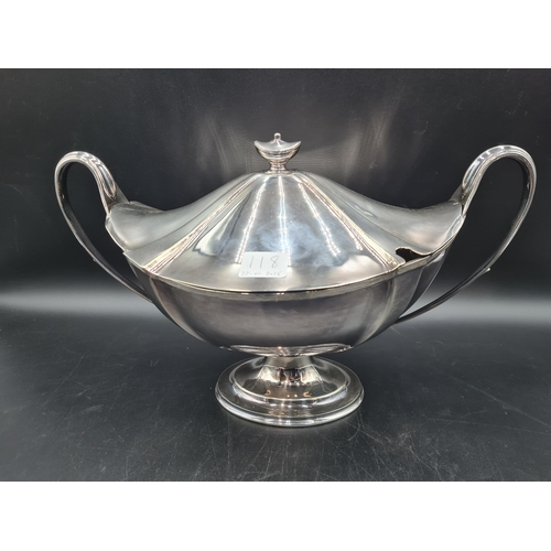 118 - A plated oval two handled Soup Tureen and Cover with urn finial