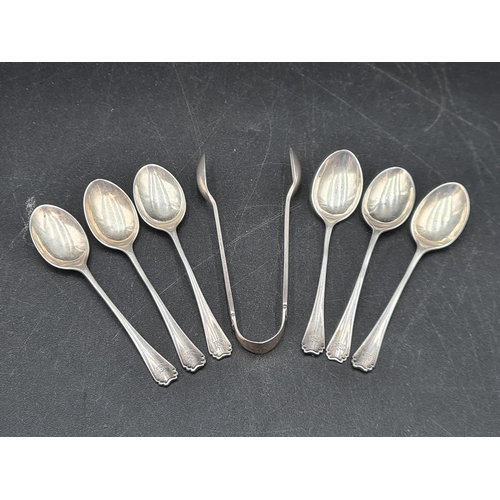 124 - Six George V silver Coffee Spoons, Sheffield 1920, and a pair of Sugar Tongs, Sheffield 1917