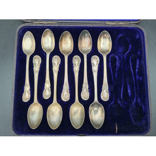 126 - Nine Victorian silver Teaspoons with scroll stems, London 1896, in case