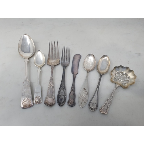 130 - A Russian style Dessert Spoon fiddle and shell pattern, a similar Teaspoon, plus sterling Sifting Sp... 