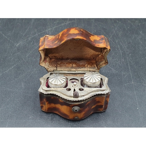 143 - A 19th Century tortoiseshell small Box with serpentine front, containing two small white metal lidde... 