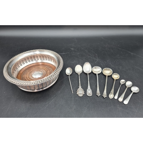 150 - A pierced circular plated Coaster and various silver and plated Condiment and other Spoons