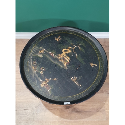 16 - A Chinese style lacquered circular Occasional Table decorated birds and figures in cream on a green ... 