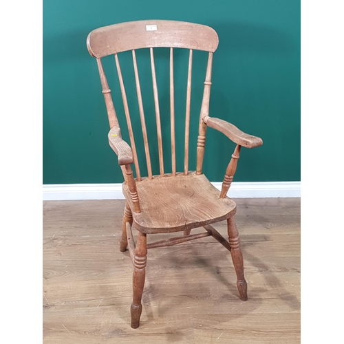 2 - A 19th century stick back Kitchen Elbow Chair in beech, elm, etc having solid seat on turned legs (R... 