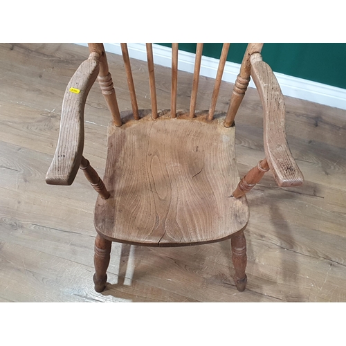 2 - A 19th century stick back Kitchen Elbow Chair in beech, elm, etc having solid seat on turned legs (R... 