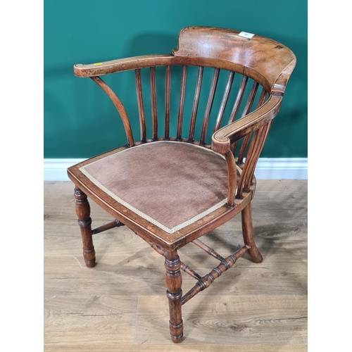 20 - A late Victorian mahogany Elbow Chair with rail back, upholstered seat on turned front legs, and ano... 