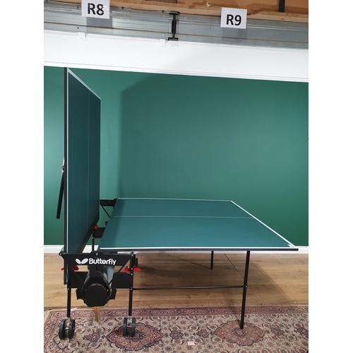 23 - A Butterfly Folding table Tennis Table on casters (R6)