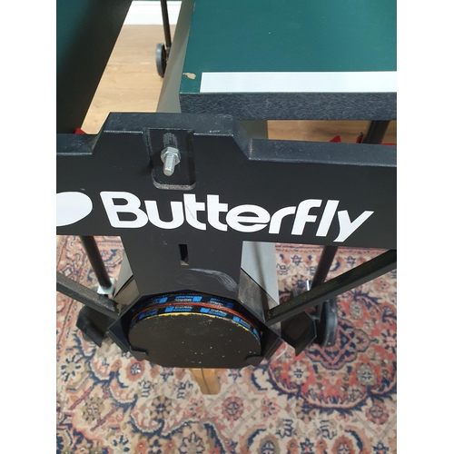 23 - A Butterfly Folding table Tennis Table on casters (R6)