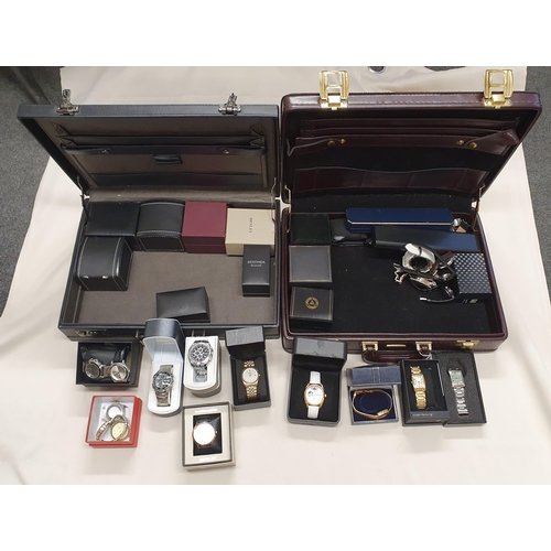 269 - Two briefcases containing a collection of modern mostly quartz gentleman's Wristwatches