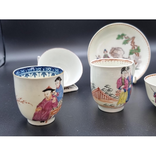 311 - Three famille rose Coffee Cans painted figures and flowers, a Tea Bowl (chipped) and a Tea Bowl and ... 