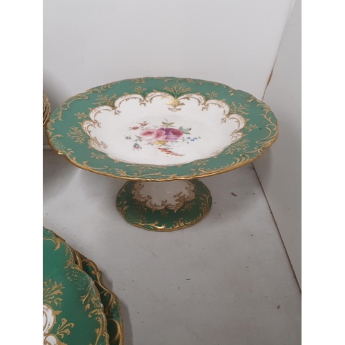 322 - A Wedgwood part Dessert Service to include two Comports, Side Plates, with floral and gilt designs, ... 