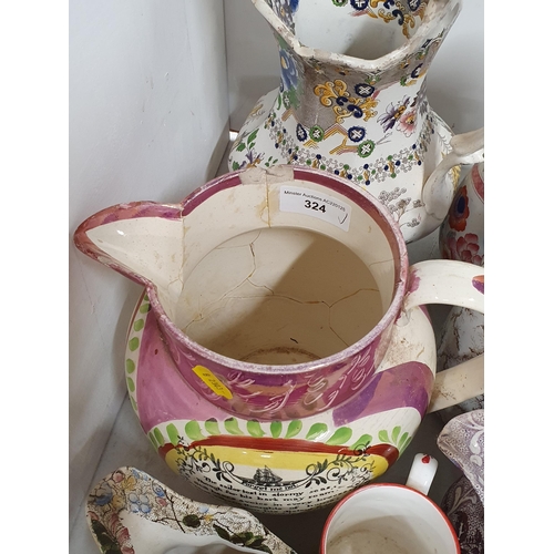 324 - A large collection of assorted ceramic Jugs to include a large pink lustre verse Jug, A/F, etc, (R4)