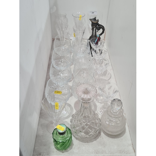 369 - A quantity of Glassware including a green glass Perfume Bottle, two glass Decanters, assorted Drinki... 