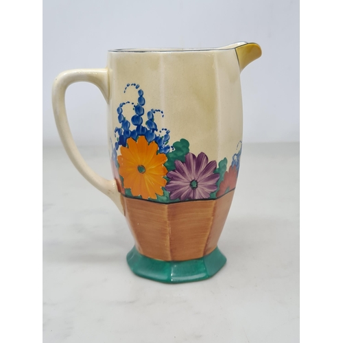 387 - A Clarice Cliff octagonal Jug with 