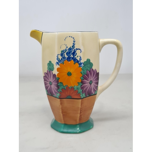 387 - A Clarice Cliff octagonal Jug with 