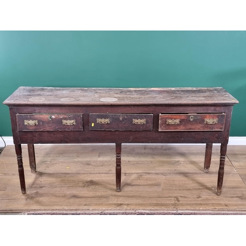 488 - An antique oak Dresser Base with three piece top above three fitted drawers on three turned front su... 