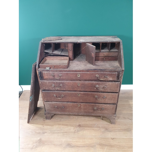 498 - An antique oak Bureau with fitted interior and fitted four long drawers, 3ft W in need of restoratio... 