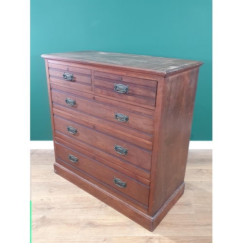 505 - A mahogany Chest of two short over three long drawers with stylised floral handles raised on plinth ... 