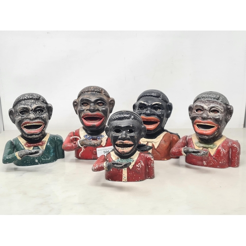 506 - Five assorted cast and aluminium figural Money Boxes, four with red coats and one with green coat