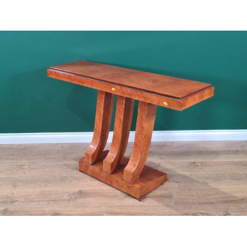 512 - A 20th Century burr walnut Console Table with stepped rectangular top on three shaped supports and r... 