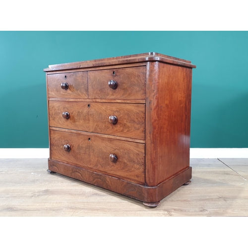 524 - A flamed mahogany Chest of two short over two long Drawers, raised on squat bun supports, 2ft 10