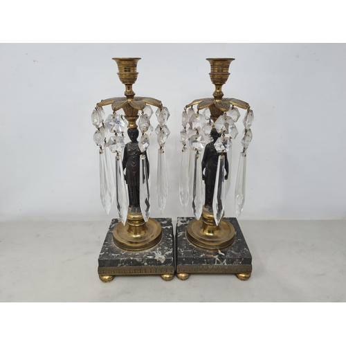 55 - A pair of 19th Century gilt brass and bronzed Table Lustres with Egyptian style classical maidens su... 