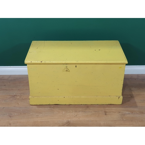 553 - A yellow painted pine Blanket Box with hinged cover and plinth base, 2ft 9in W (R6)