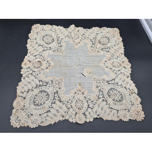 56 - A quantity of Lace including long table runner with floral design, 10ft x 2ft, table mat and place m... 