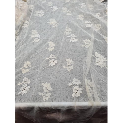 56 - A quantity of Lace including long table runner with floral design, 10ft x 2ft, table mat and place m... 