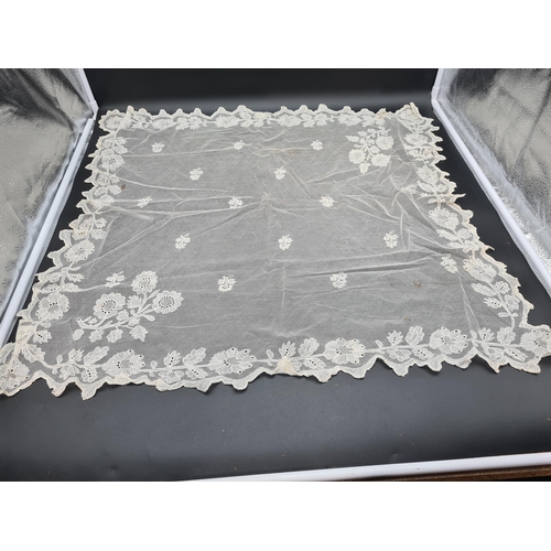 56 - A quantity of Lace including long table runner with floral design, 10ft x 2ft, table mat and place m... 