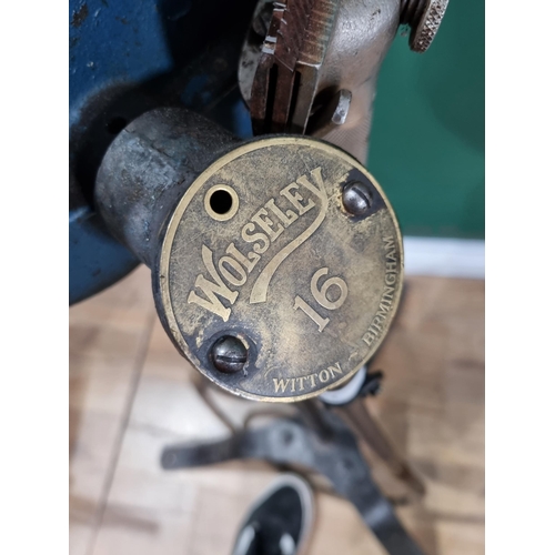 564 - A Wolseley 16 Sheep Shearing Machine with turned wooden handles and raised on tripod support, 3ft 3