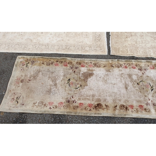 586 - Two beige coloured Rugs with floral designs, 5ft 9in x 4ft, and 5ft 2in x 3ft 1in, and a floral bord... 