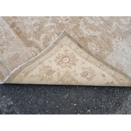 589 - Two large beige Rugs with floral designs, 9ft 8in x 6ft, and 10ft 3in x 7ft 10in