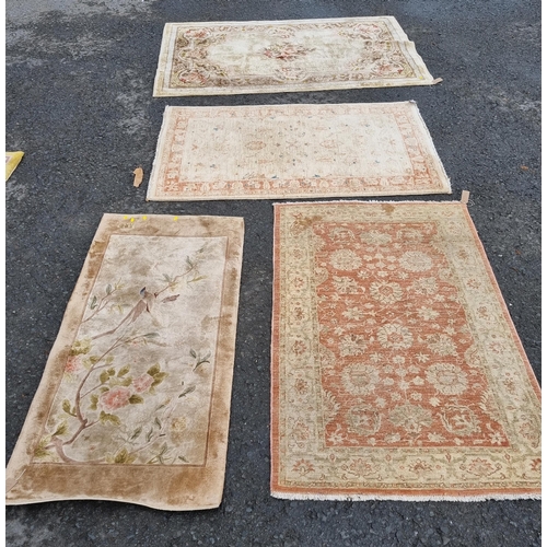 590 - Four small floral patterned Rugs