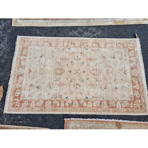 590 - Four small floral patterned Rugs