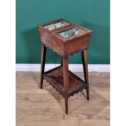 633 - A 19th Century rosewood Sewing Table with double hinged and glazed top on squared tapering supports ... 