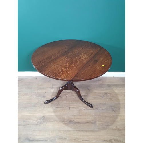 640 - An oak tilt top Tripod Table, 3ft Diam. (R2)