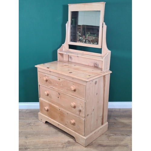 643 - A pine Dressing Chest with swing mirror, three fitted drawers and raised on plinth base, 4ft 3in Hig... 