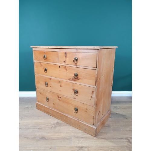 648 - A pine Chest of two short and three long graduated drawers with ring handles on plinth base, 3ft 1in... 