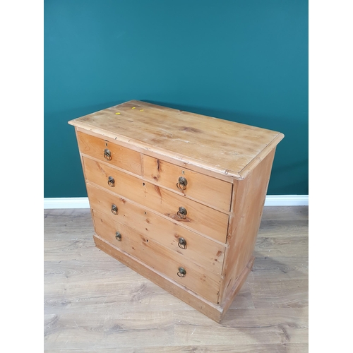 648 - A pine Chest of two short and three long graduated drawers with ring handles on plinth base, 3ft 1in... 