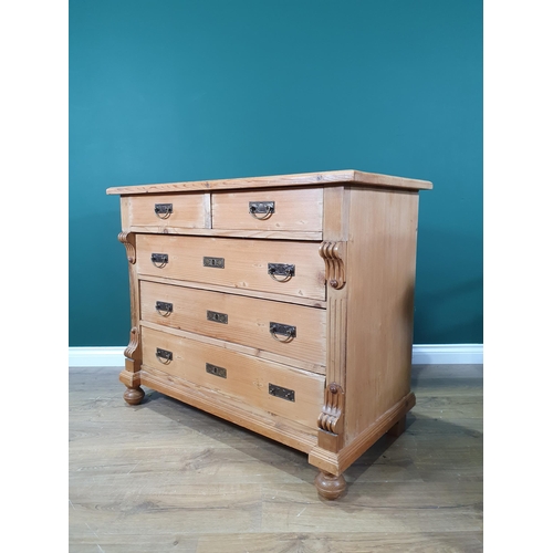 649 - A Continental pine Chest of two short over three long drawers, flanked by applied scrolled decoratio... 