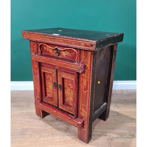 654 - An Oriental red painted Cupboard with single drawer above pair of panelled doors, decorated with sce... 